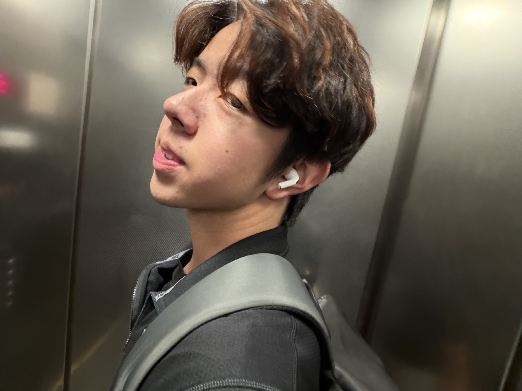 Portrait of Yilin Wang in an elevator
